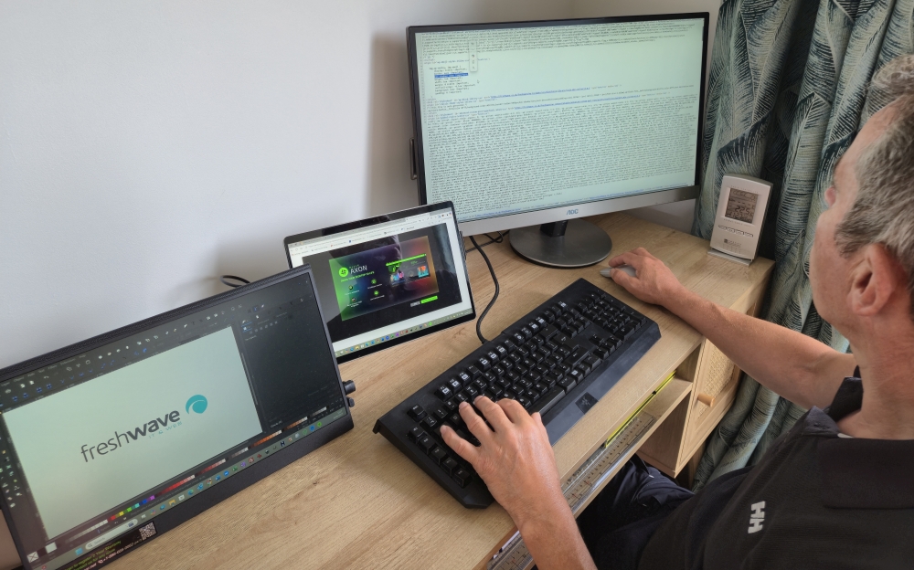 Freshwave employee working on a website
